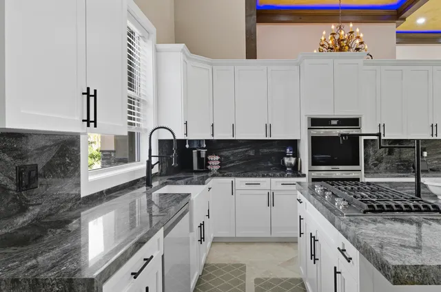 a view of a room with wooden floor and iron stairs