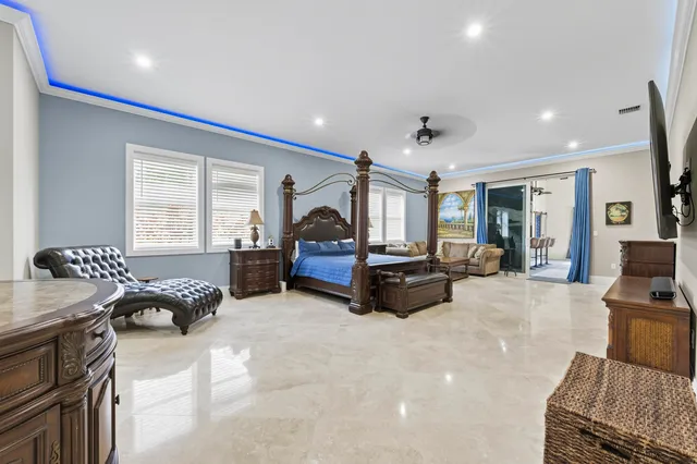 a bedroom with a bed and a painting on the wall