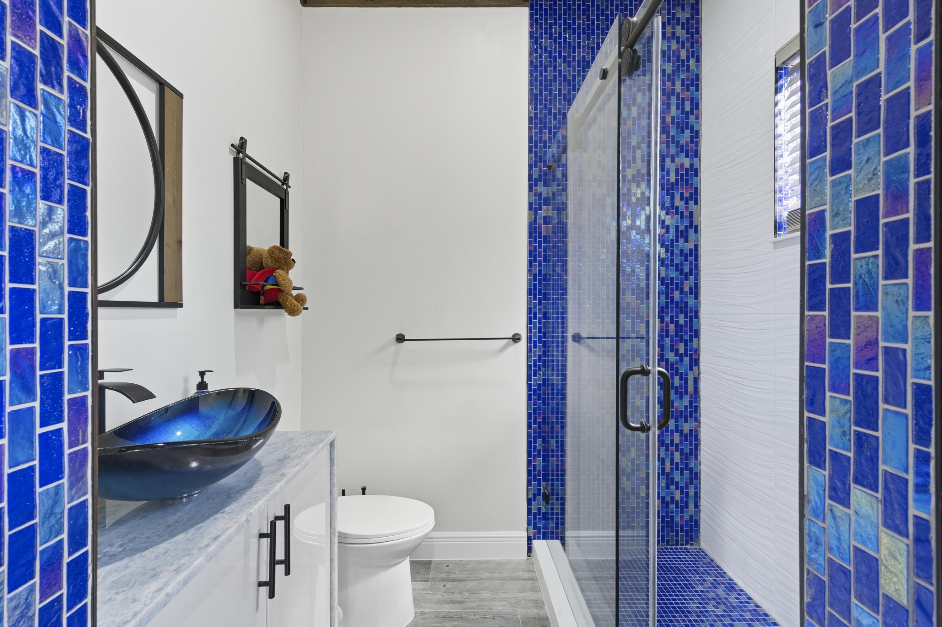 8350 Whispering Oak Way West Palm Beach, FL 33411 - Photo 23 of 51 a bathroom with a sink toilet and shower