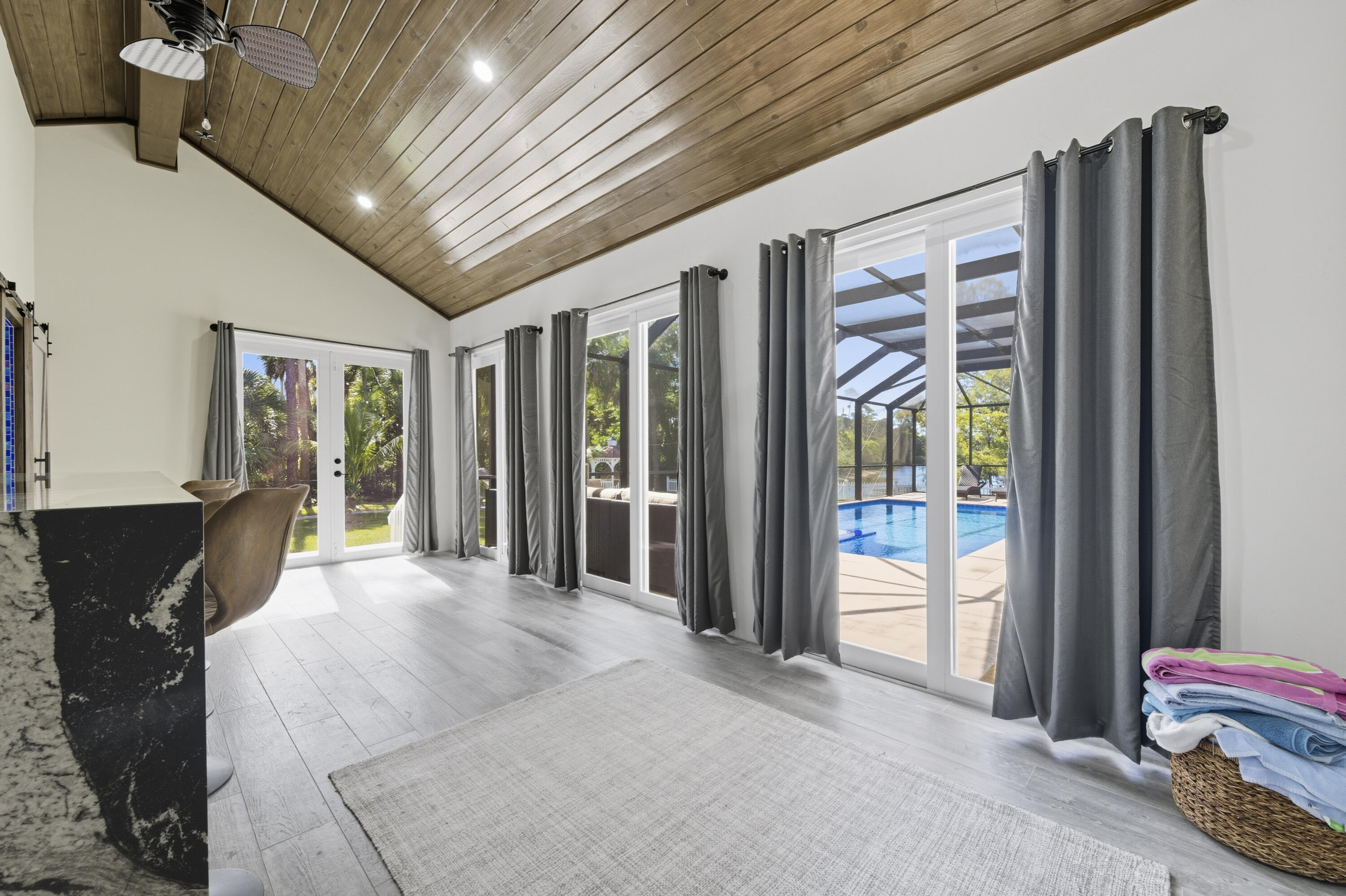 8350 Whispering Oak Way West Palm Beach, FL 33411 - Photo 24 of 51 a spacious bedroom with a large bed and a chandelier