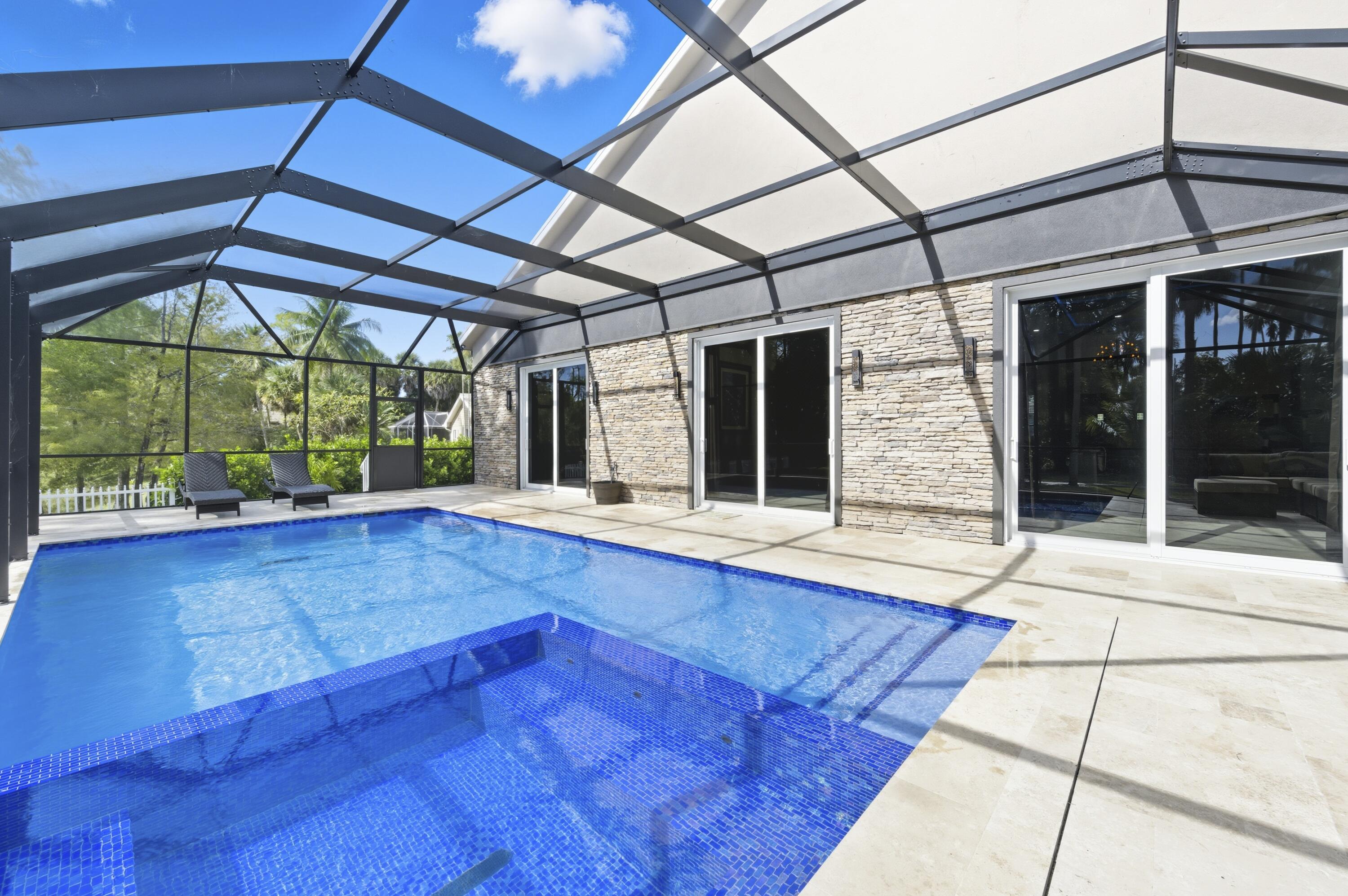 8350 Whispering Oak Way West Palm Beach, FL 33411 - Photo 26 of 51 a view of a room with wooden floor and iron stairs