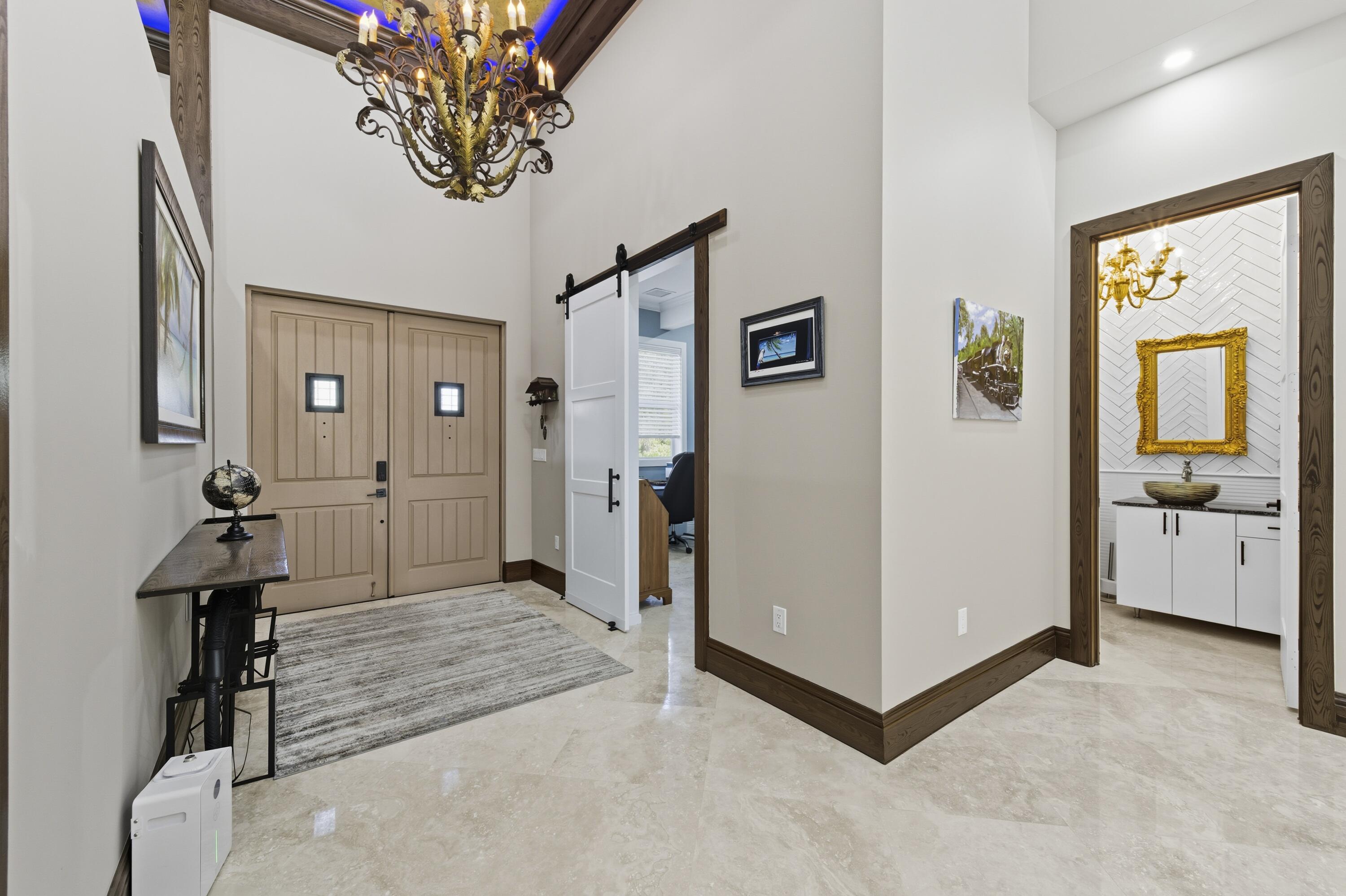 8350 Whispering Oak Way West Palm Beach, FL 33411 - Photo 38 of 51 a view of a hallway with closet and a potted plant