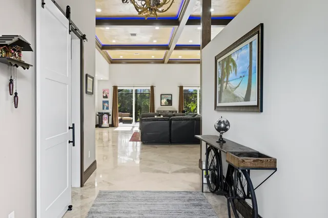 a kitchen with stainless steel appliances granite countertop a sink a stove and a wooden floors