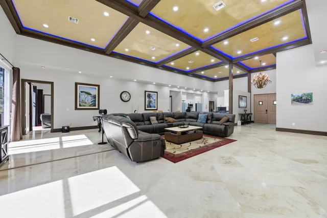 a kitchen with granite countertop a stove sink and cabinets