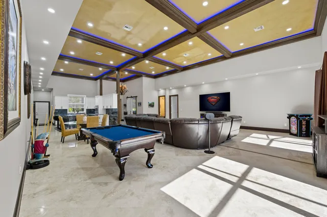 a kitchen with stainless steel appliances a refrigerator and a stove top oven