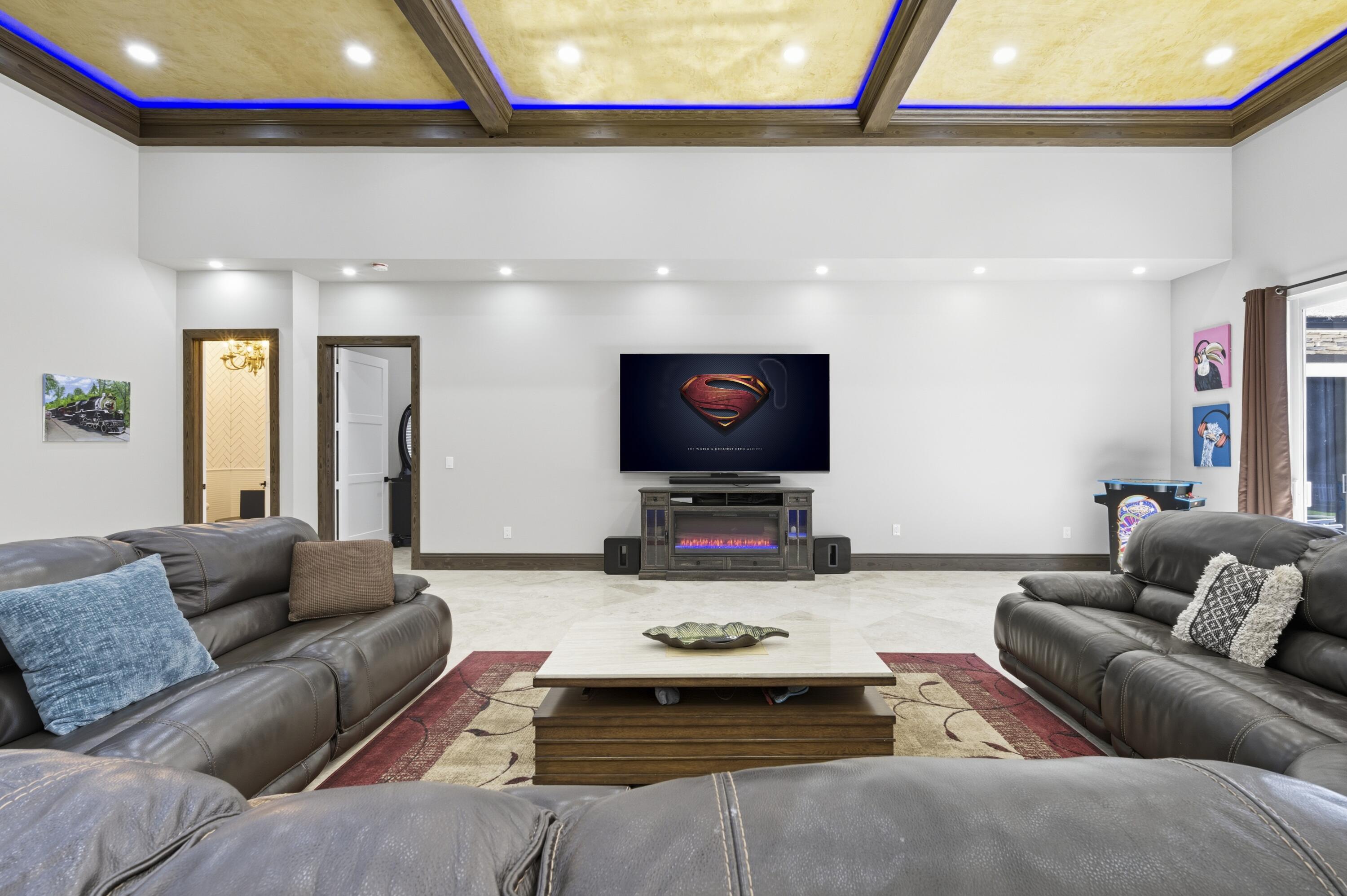 8350 Whispering Oak Way West Palm Beach, FL 33411 - Photo 9 of 51 a living room with furniture and a flat screen tv