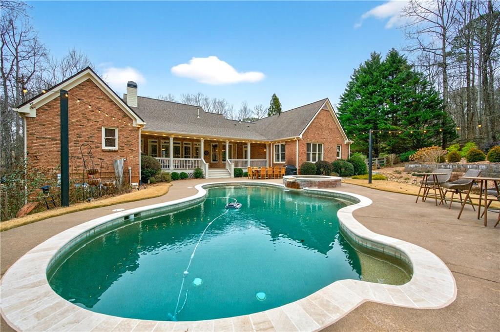 121 Laurel Ridge Drive Alpharetta, GA 30004 - Photo 13 of 14 a view of a house with swimming pool