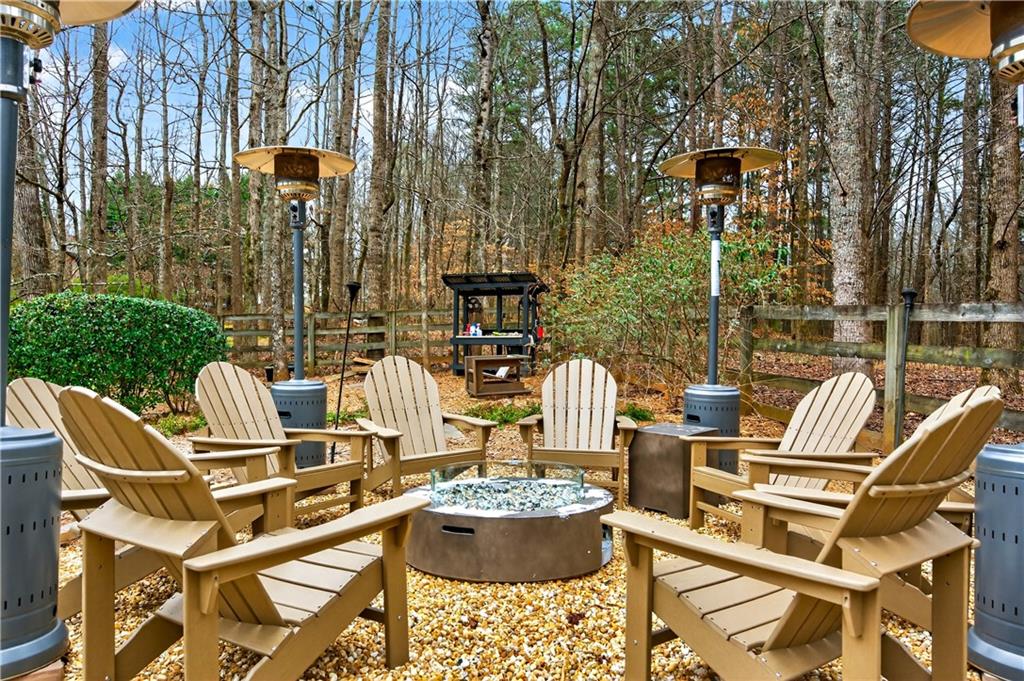 121 Laurel Ridge Drive Alpharetta, GA 30004 - Photo 14 of 14 a view of a patio with table and chairs and potted plants