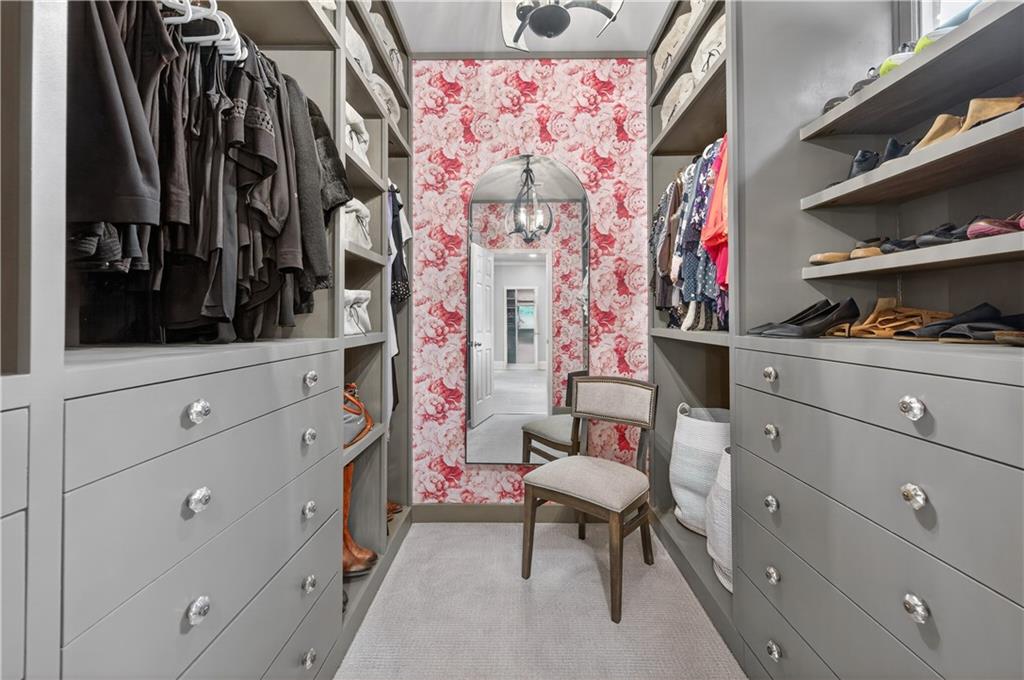 121 Laurel Ridge Drive Alpharetta, GA 30004 - Photo 8 of 14 a view of walk in closet with clothes and shoes