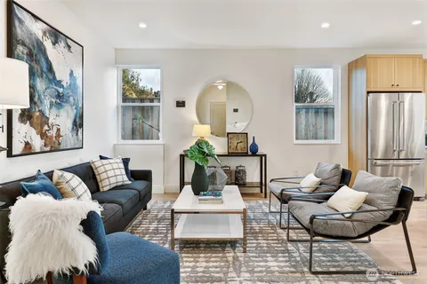 a bedroom with bed and wooden floor