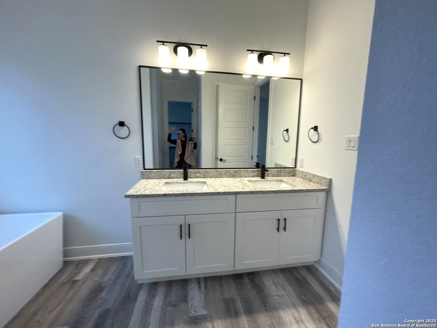 101 Daniel Jackson Blanco, TX 78606 - Photo 5 of 11 a bathroom with a double vanity sink and a mirror