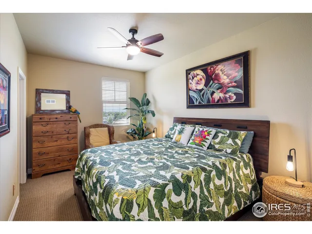 a bathroom with a granite countertop sink a mirror and a shower