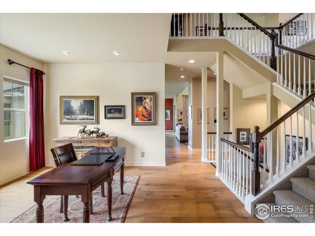 a workspace with furniture window and wooden floor