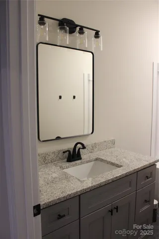 a bathroom with sink and mirror