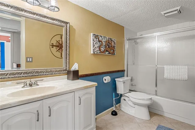 a living room with furniture a rug and a chandelier