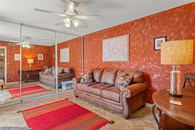 a bedroom with a bed and glass door