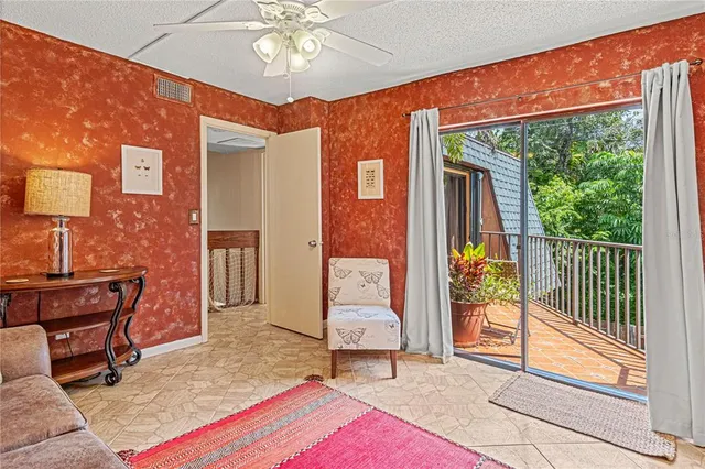 a balcony view with a potted plant