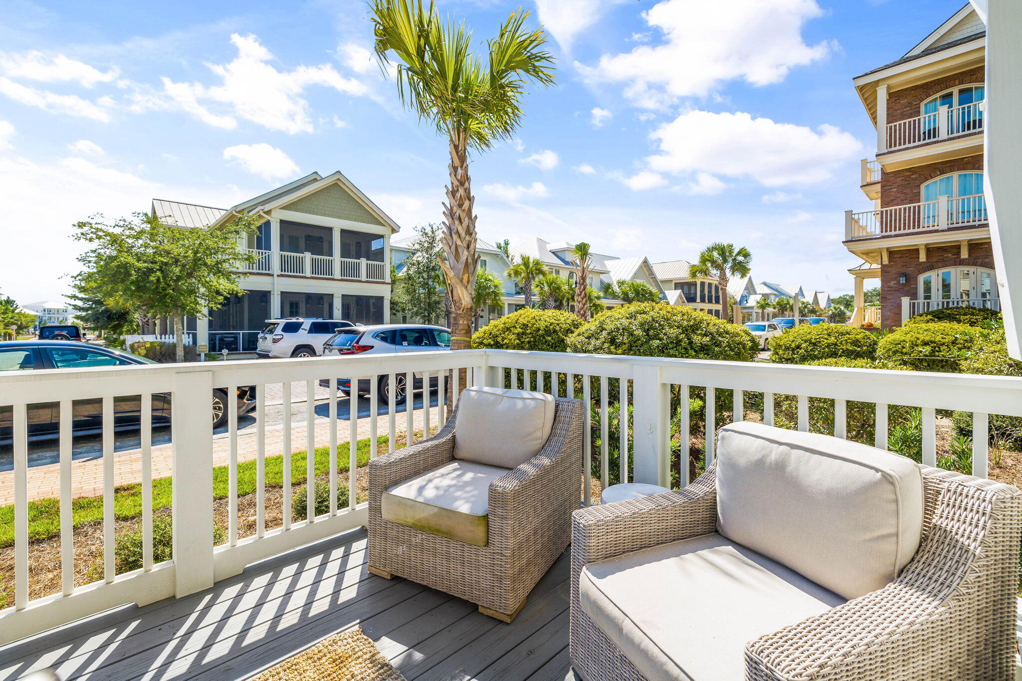 80 Wharf Ln Inlet Beach, Unit B Inlet Beach, FL 32461 - Photo 20 of 43 a balcony of a house with wooden floor outdoor seating and yard in the back