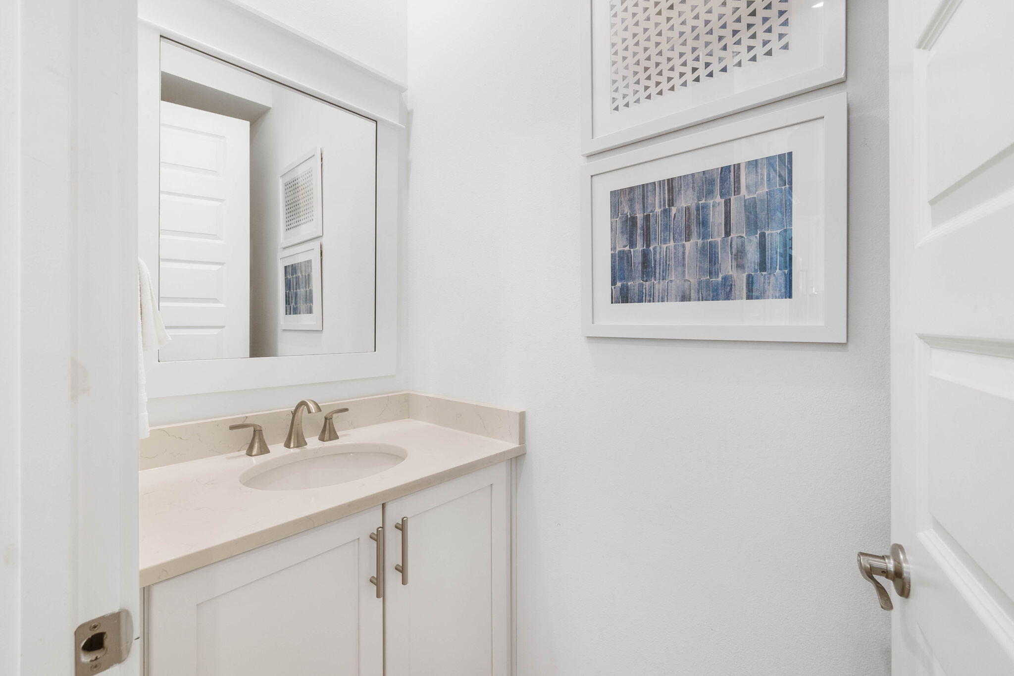 80 Wharf Ln Inlet Beach, Unit B Inlet Beach, FL 32461 - Photo 24 of 43 a bathroom with a sink and a mirror