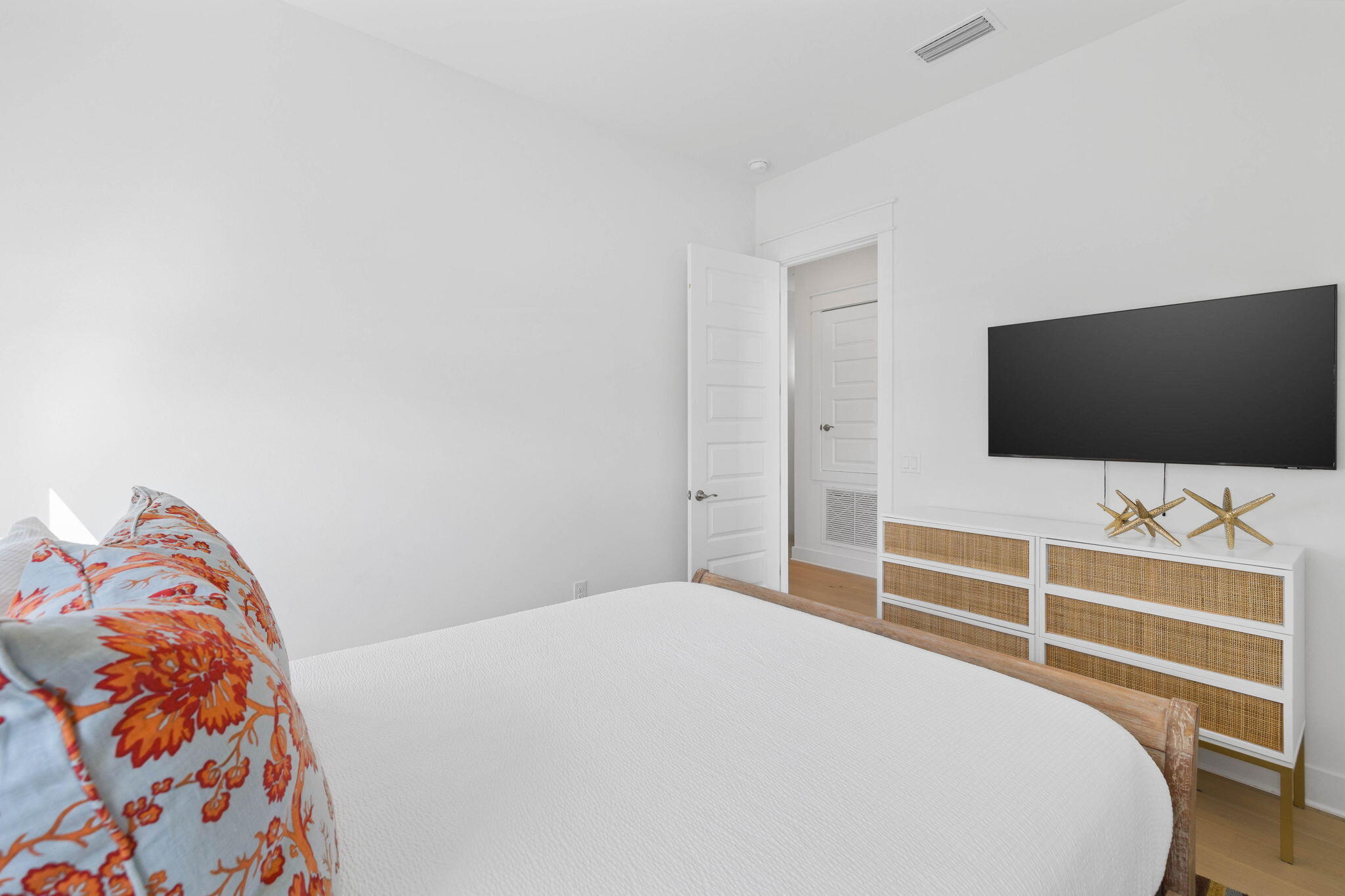 80 Wharf Ln Inlet Beach, Unit B Inlet Beach, FL 32461 - Photo 28 of 43 a bedroom with a bed and a flat screen tv