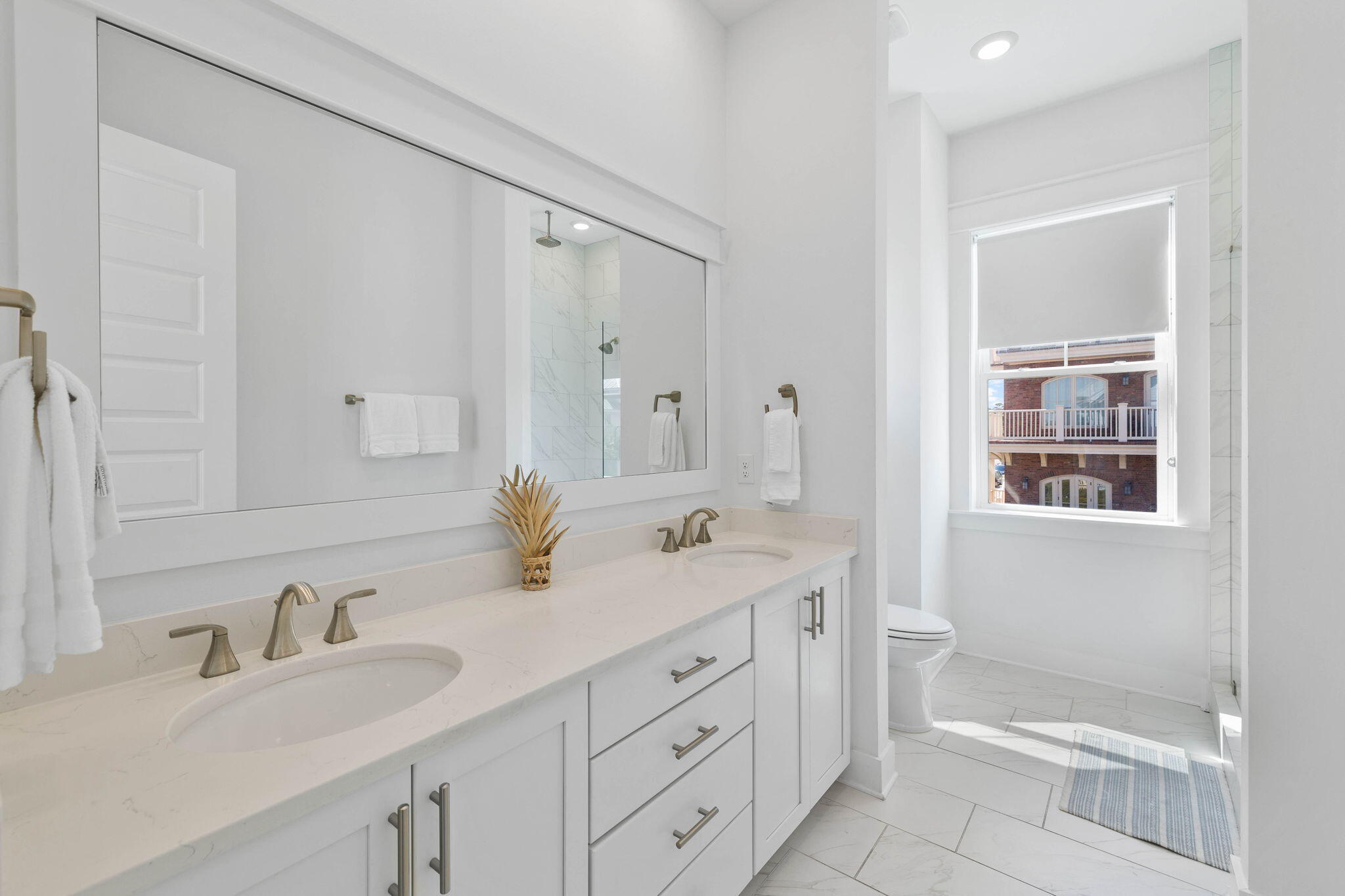 80 Wharf Ln Inlet Beach, Unit B Inlet Beach, FL 32461 - Photo 32 of 43 a bathroom with a granite countertop sink mirror and double