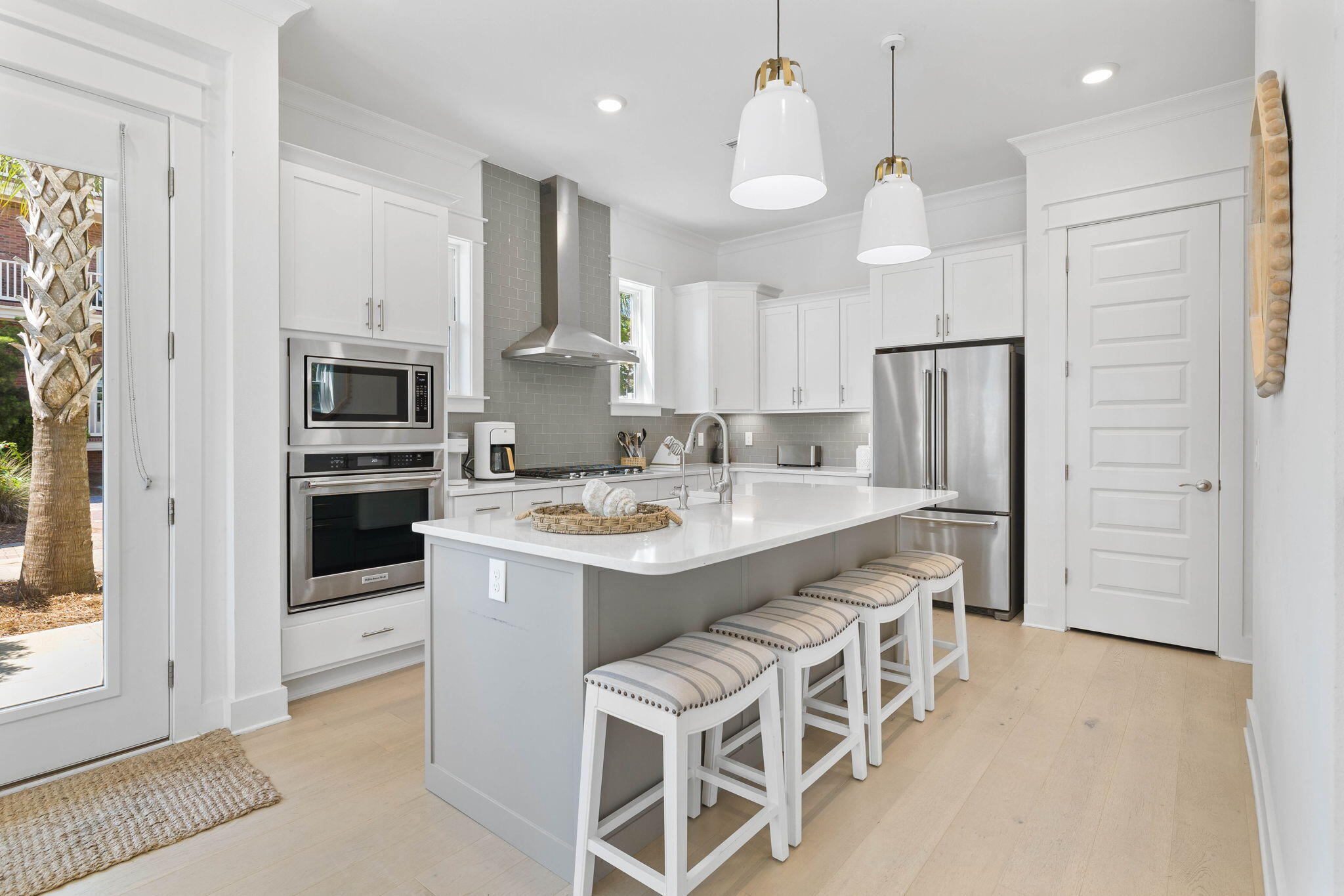 80 Wharf Ln Inlet Beach, Unit B Inlet Beach, FL 32461 - Photo 8 of 43 a kitchen that has a lot of white cabinets and stainless steel appliances