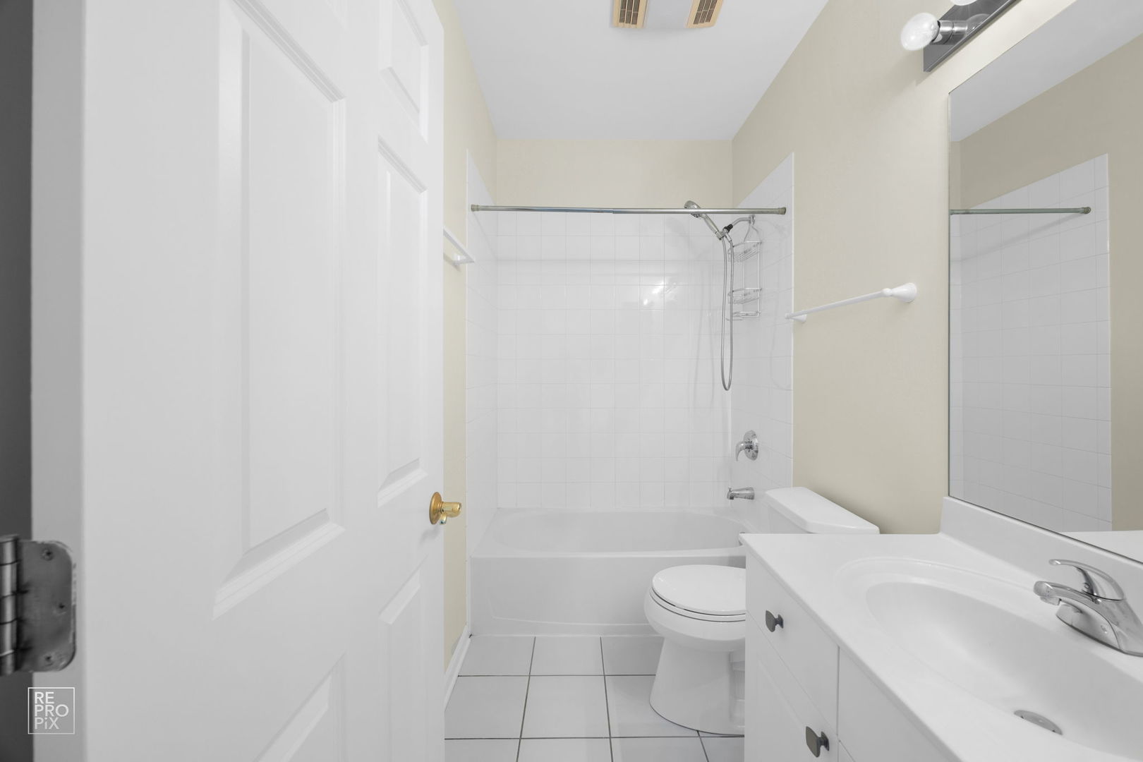640 McHenry Road, Unit 208 Wheeling, IL 60090 - Photo 12 of 21 a bathroom with a toilet sink vanity and shower