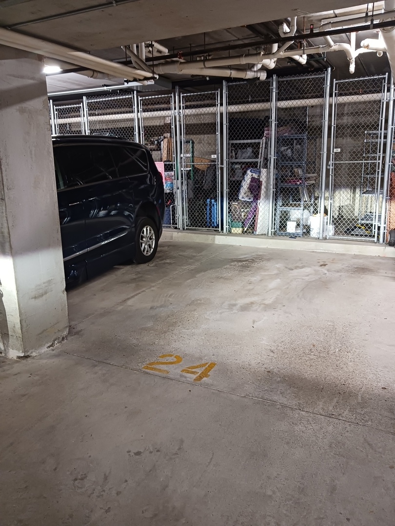 640 McHenry Road, Unit 208 Wheeling, IL 60090 - Photo 18 of 21 a car parked in garage