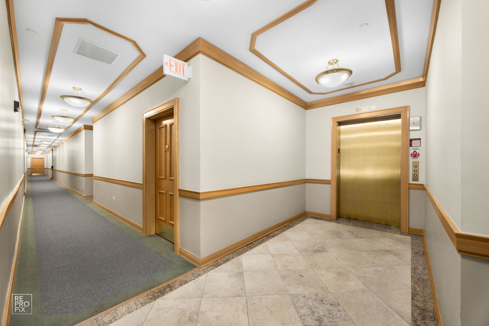 640 McHenry Road, Unit 208 Wheeling, IL 60090 - Photo 19 of 21 a view of a hallway with staircase