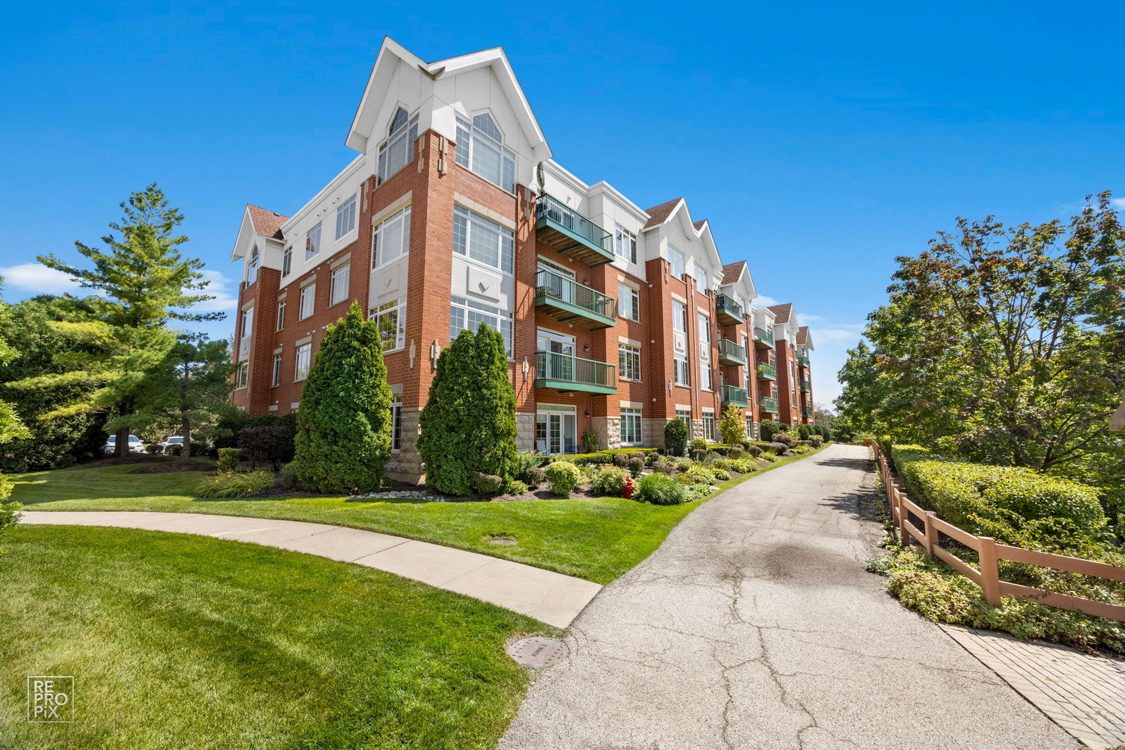 640 McHenry Road, Unit 208 Wheeling, IL 60090 - Photo 21 of 21 a view of a building with a yard