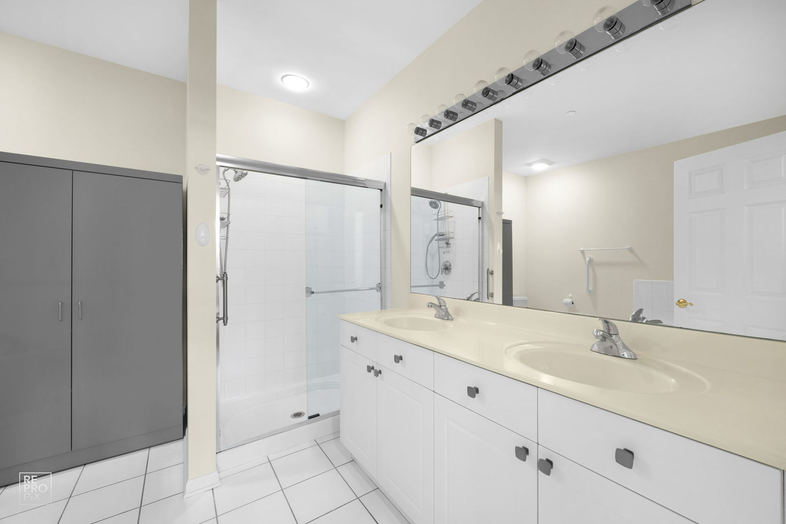 640 McHenry Road, Unit 208 Wheeling, IL 60090 - Photo 10 of 21 a bathroom with a double vanity sink mirror and shower