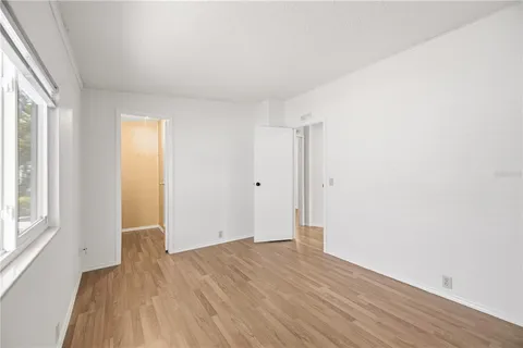 a bathroom with a toilet a sink and a mirror