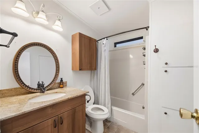a view of a hallway with wooden floor and closet