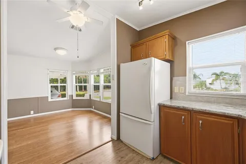 a white refrigerator freezer sitting inside of a kitchen