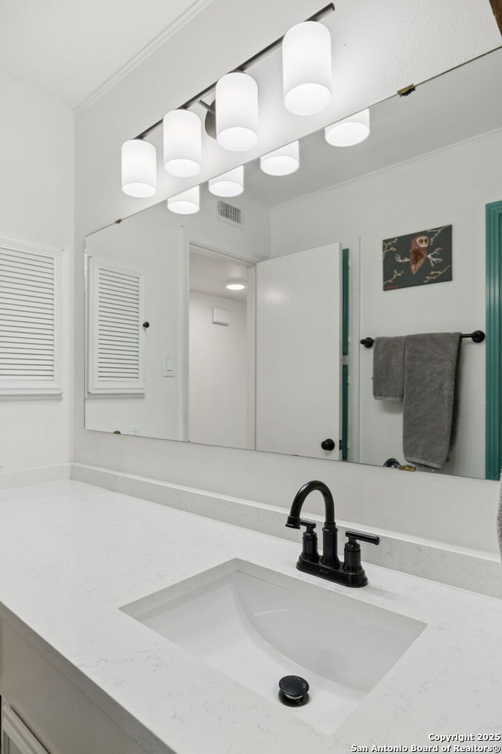 102 Ruelle Lane, Unit 220B San Antonio, TX 78209 - Photo 27 of 37 a bathroom with a sink a bathtub and a shower