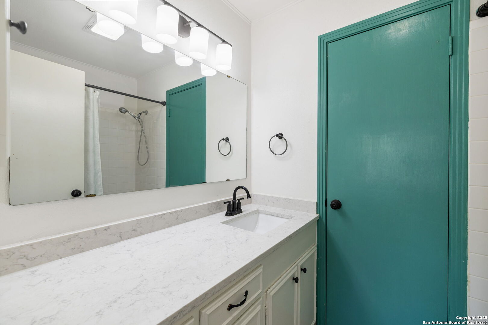 102 Ruelle Lane, Unit 220B San Antonio, TX 78209 - Photo 30 of 37 a bathroom with a sink and a mirror