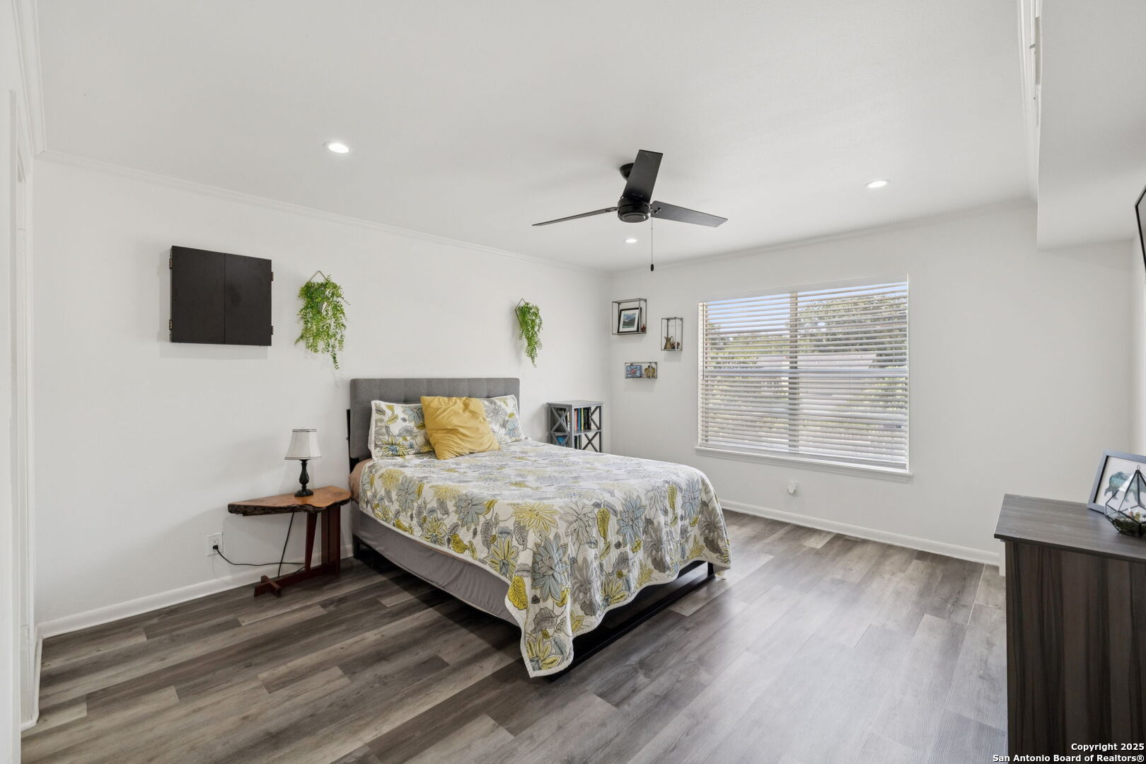 102 Ruelle Lane, Unit 220B San Antonio, TX 78209 - Photo 32 of 37 a bedroom with a bed a fireplace and a large window