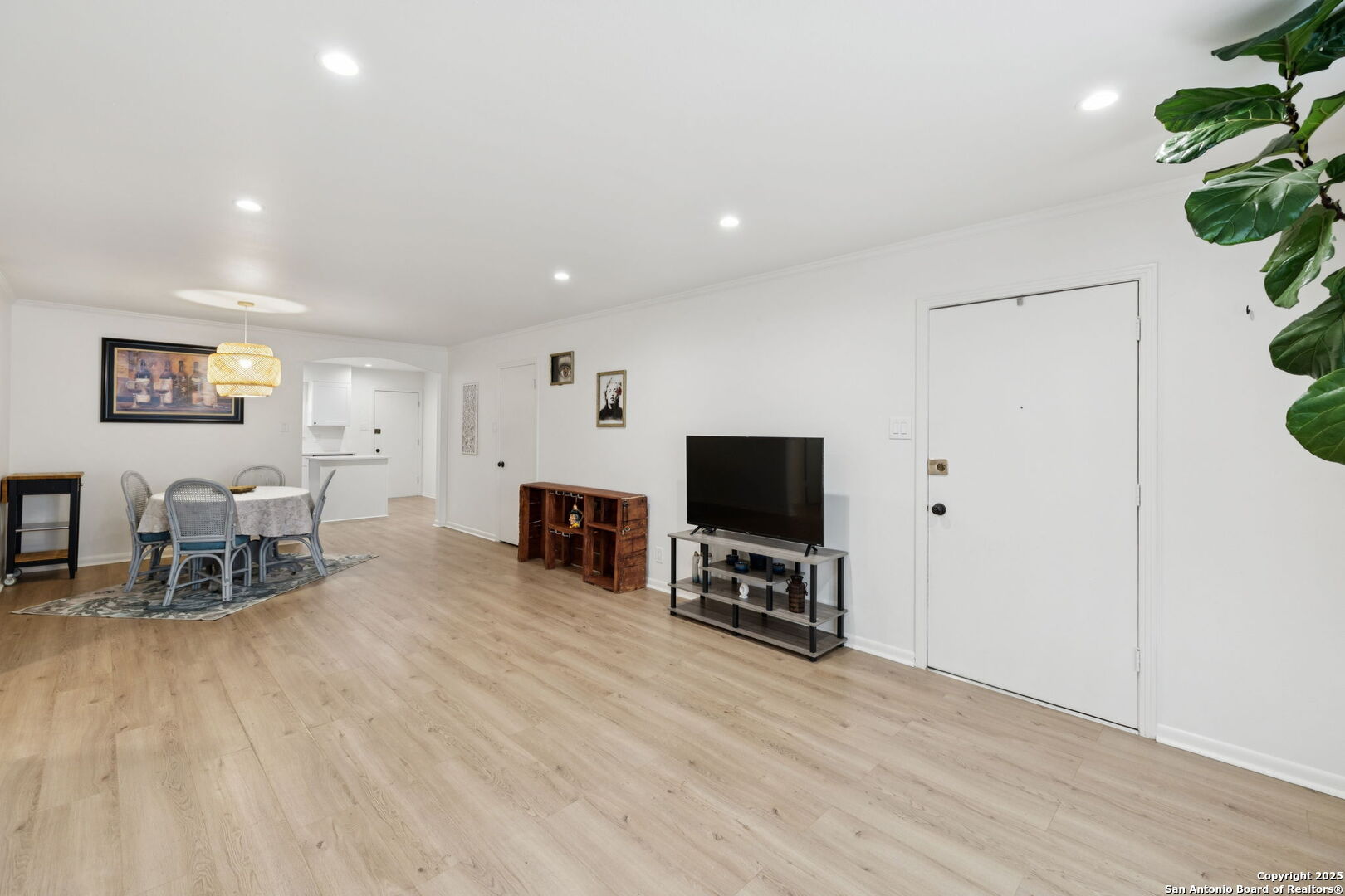 102 Ruelle Lane, Unit 220B San Antonio, TX 78209 - Photo 8 of 37 a living room with furniture and a flat screen tv