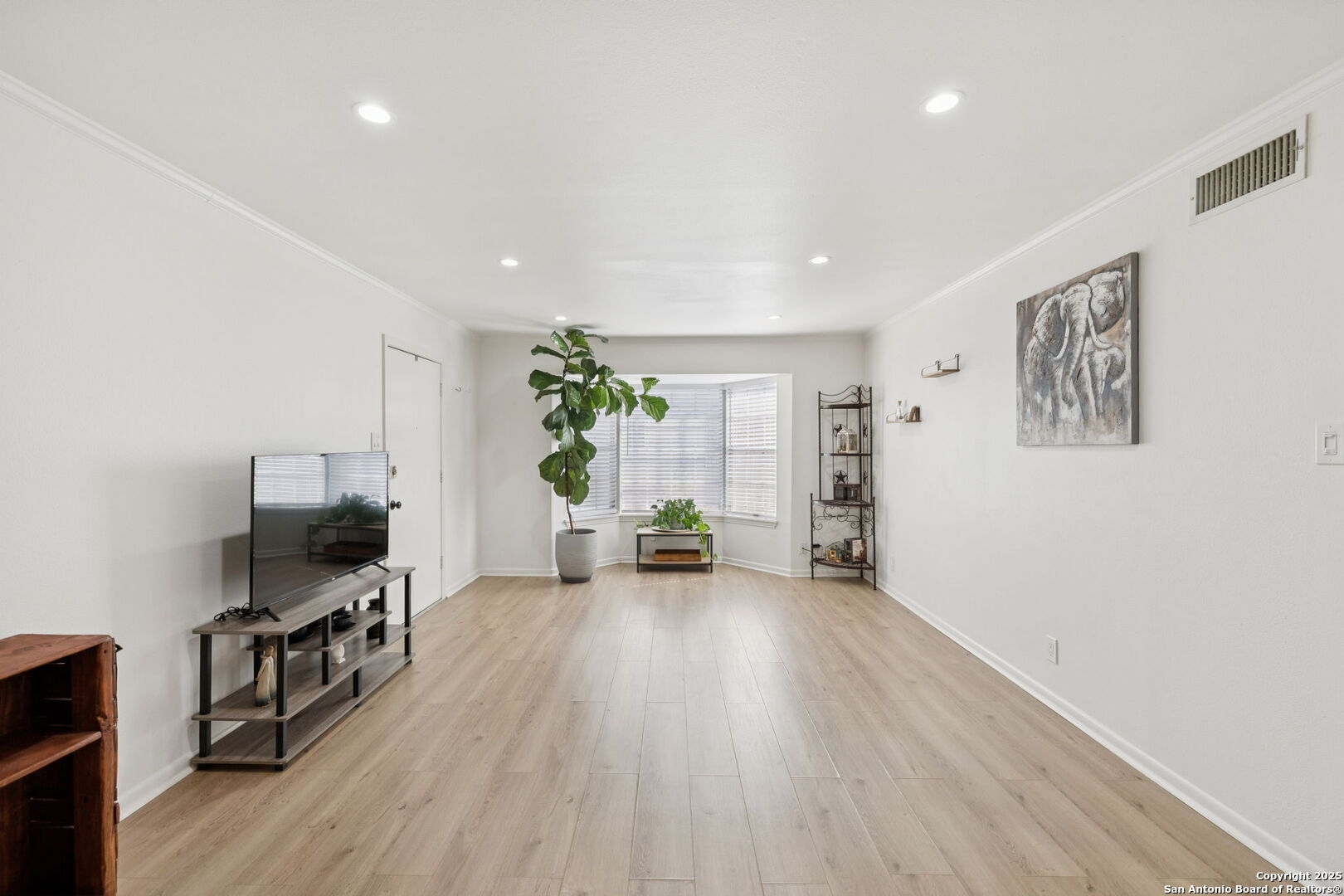 102 Ruelle Lane, Unit 220B San Antonio, TX 78209 - Photo 10 of 37 a living room with furniture and a flat screen tv