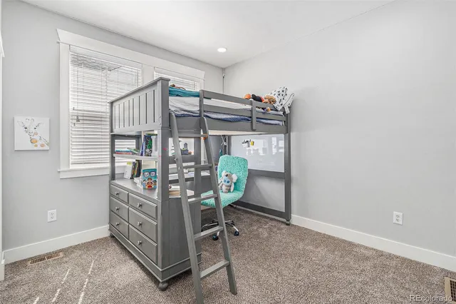 an aerial view of a house with a lake view