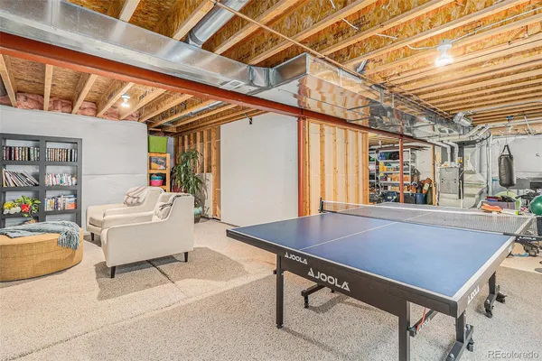 a living room with furniture and a table