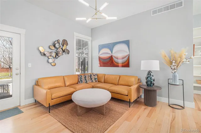 a kitchen with a sink a stove a refrigerator and cabinets