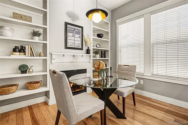 a large white kitchen with a large window
