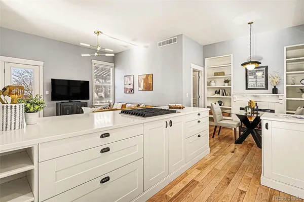 a view of living room kitchen and dining room