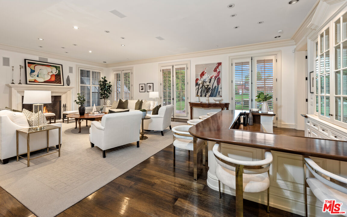 805 North Alpine Drive Beverly Hills, CA 90210 - Photo 11 of 48 a living room with furniture large window and flat screen tv