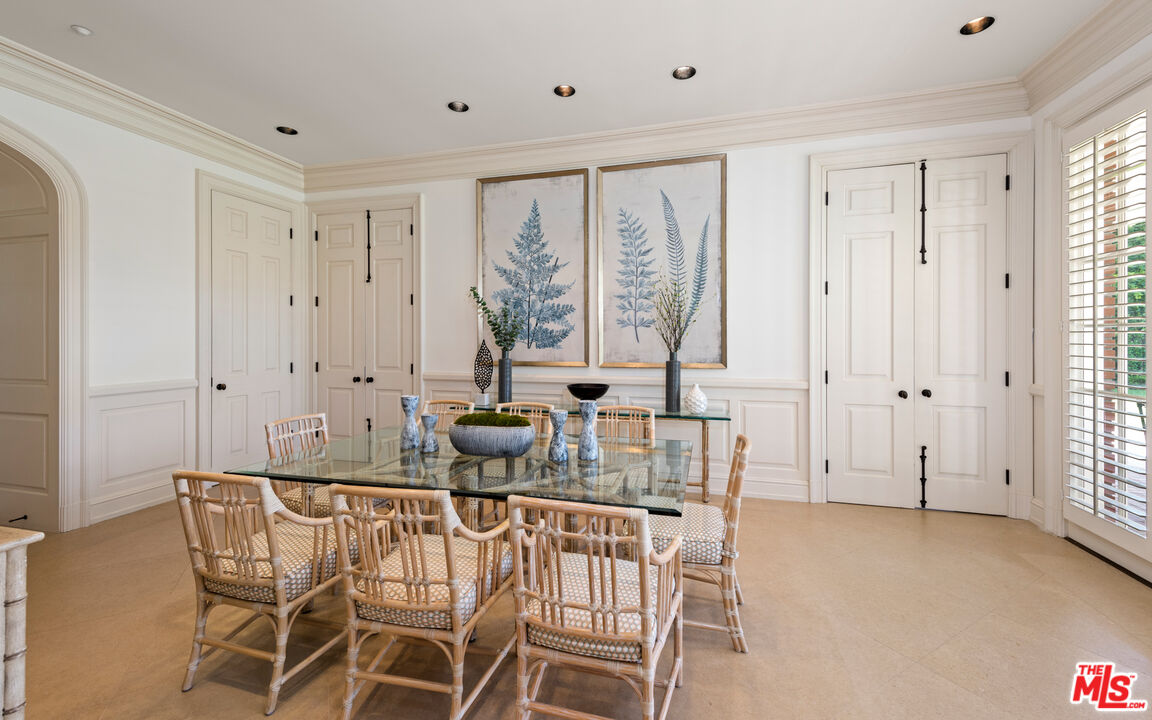 805 North Alpine Drive Beverly Hills, CA 90210 - Photo 15 of 48 a view of a dining room with furniture and a large window