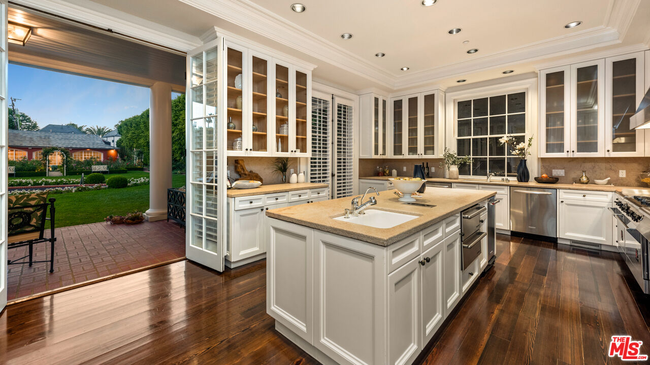 805 North Alpine Drive Beverly Hills, CA 90210 - Photo 19 of 48 a kitchen with a stove and a sink