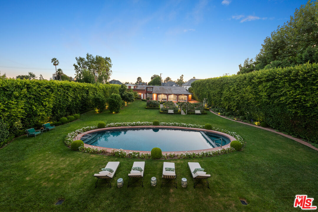 805 North Alpine Drive Beverly Hills, CA 90210 - Photo 29 of 48 a view of swimming pool with a yard