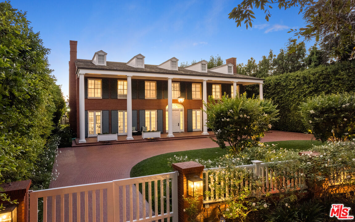 805 North Alpine Drive Beverly Hills, CA 90210 - Photo 3 of 48 a front view of house with yard and trees around