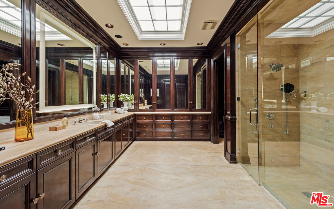 805 North Alpine Drive Beverly Hills, CA 90210 - Photo 33 of 48 a large kitchen with a large window and stainless steel appliances